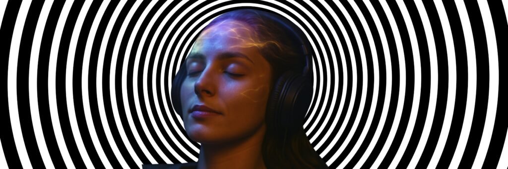 Woman with eyes closed wearing headphones in front of concentric black-and-white circles, symbolizing a deep state of focus and hypnosis.