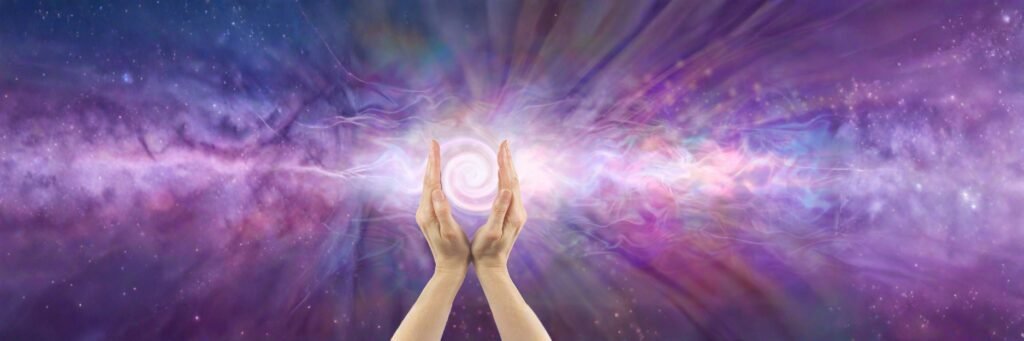 Hands channeling energy light in a cosmic purple aura field, symbolizing inner energy and spiritual awareness